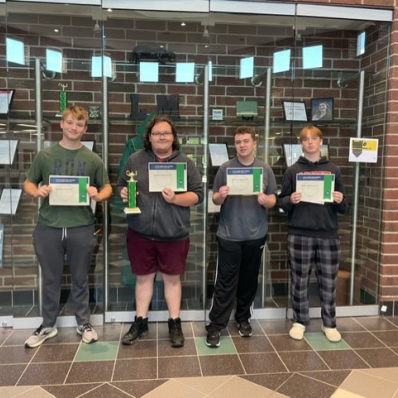 students smiling holding certificate